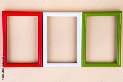 Colorful picture or photo frames on a beige paper background. Copy space photo