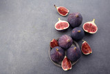 Fresh ripe figs on dark table. Beautiful blue violet figs with empty copyspace close up