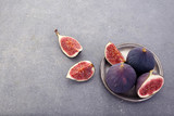 Ripe sweet figs on dark background . Healthy mediterranean fig fruit . Top view