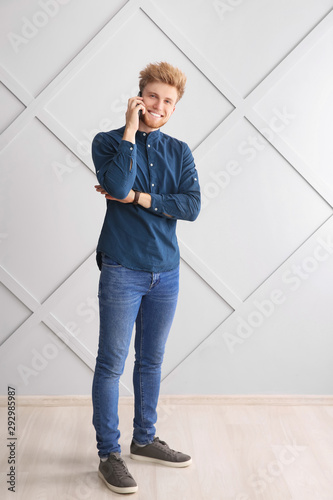 Portrait of young man talki...