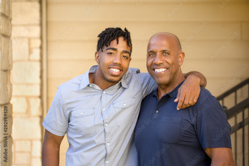 African American father and his adult son. African American father and his adult son.