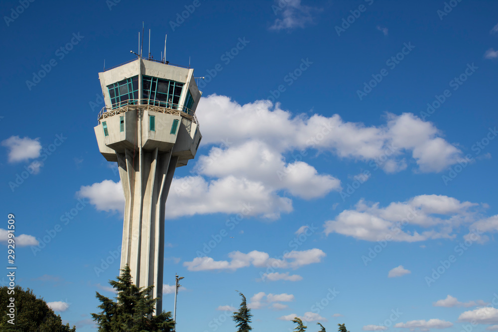 Ataturk airport air control tower. Close-up on the background of sky and clouds. Ataturk airport air control tower. Close-up on the background of sky and clouds.