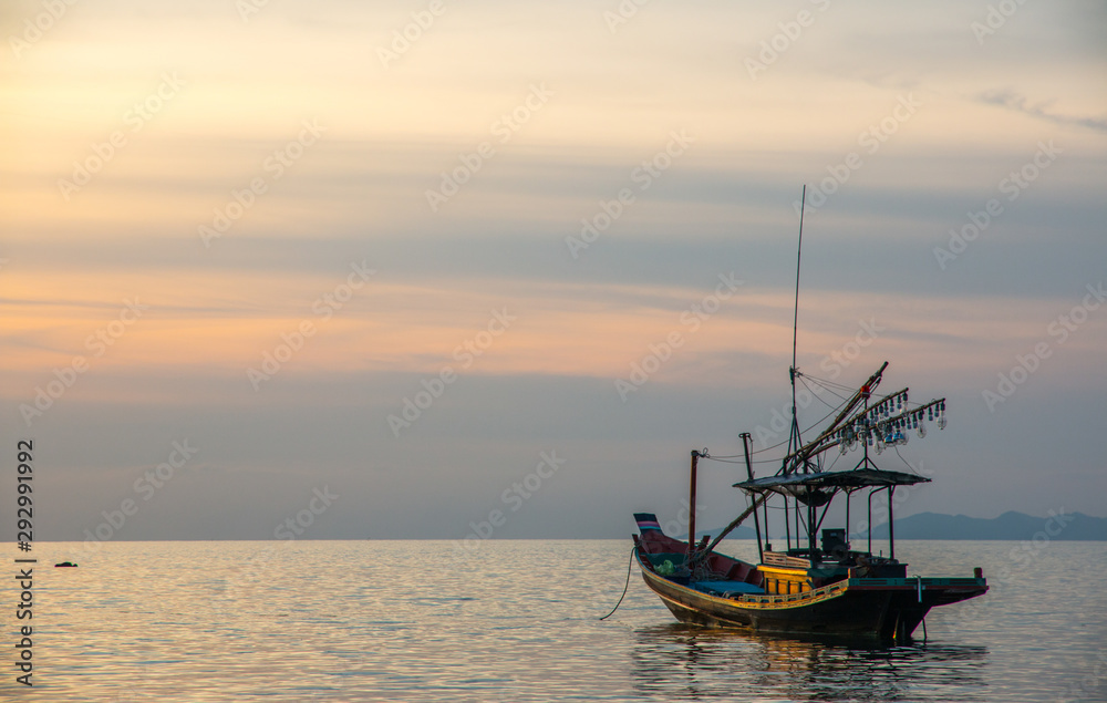 Fishermen boat at sunset near Koh Phangan island, Thailand