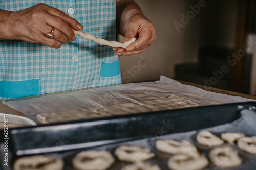 hands cooking making donuts or traditional sweets