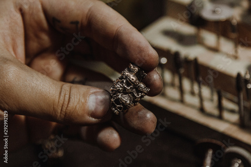Jeweler working at workshop © Iryna