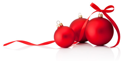 Three red Christmas decoration baubles with ribbon bow isolated on white background