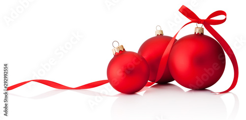 Three red Christmas decoration baubles with ribbon bow isolated on white background photo