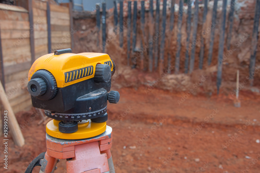 Surveyor equipment at a construction site. Measuring instrument close-up. Surveyor equipment at a construction site. Measuring instrument close-up.