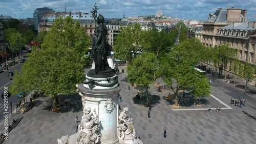 Drone approaching bronze sculpture Marianne in Place de la Republique Paris France photo