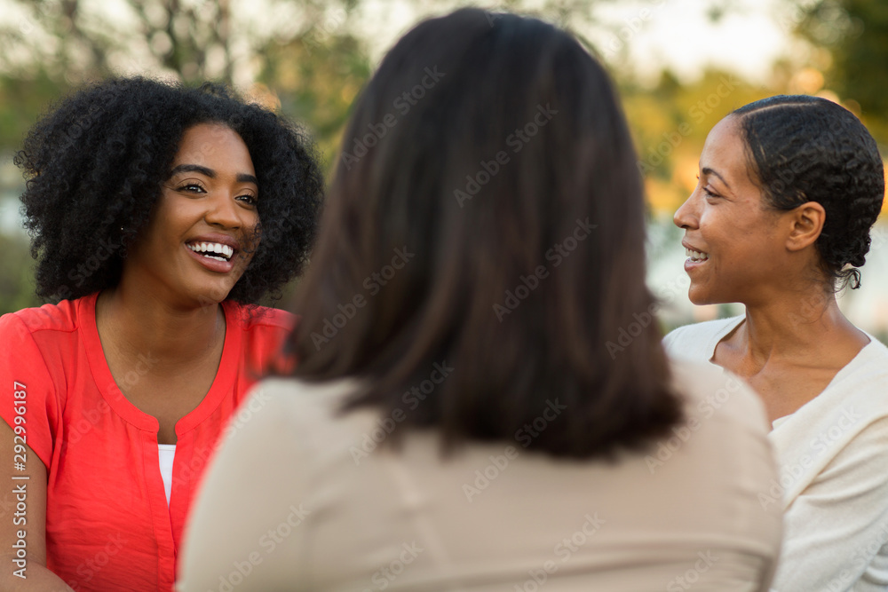 Diverse group of friends talking and laughing. Diverse group of friends talking and laughing.