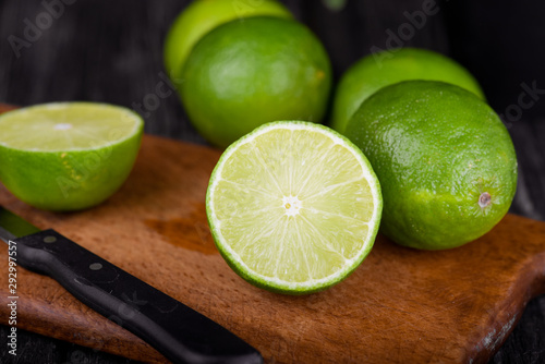 lime juice with lime slices on wooden table. Detox diet