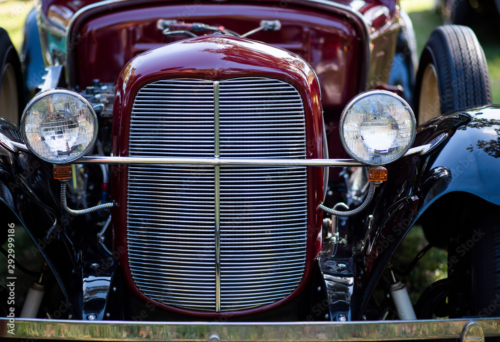 front grille of vintage car, headlights of rare vintage car at a car show