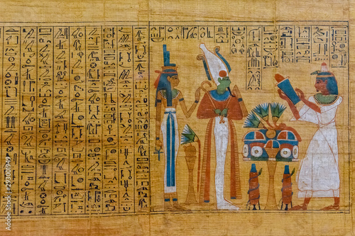 Egyptian ancient papyrus with the different pictures and hieroglyphics photo