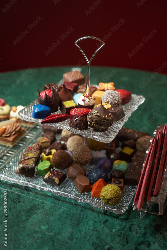 Dessert plate with assortment of sweets, piece of cake, cookies, biscuits