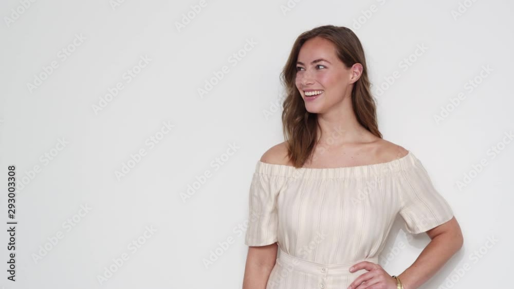 Woman Wearing an Off-shoulder Dress Standing at a Studio with White Backdrop Woman Wearing an Off-shoulder Dress Standing at a Studio with White Backdrop