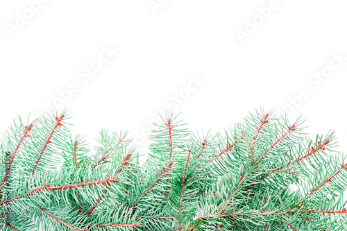 New Year greeting card template from green beautiful fluffy Christmas tree branches as a border at the bottom of the picture with an empty place for text isolated on white background