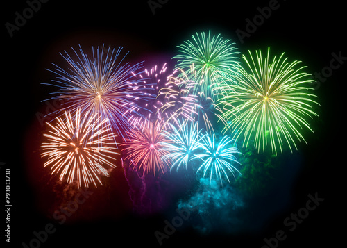 A large and bright fireworks display filling the night sky with glitter and sparks. Celebration background.