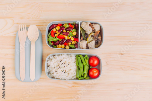 Lunch box with healthy food on the wooden table with copy space