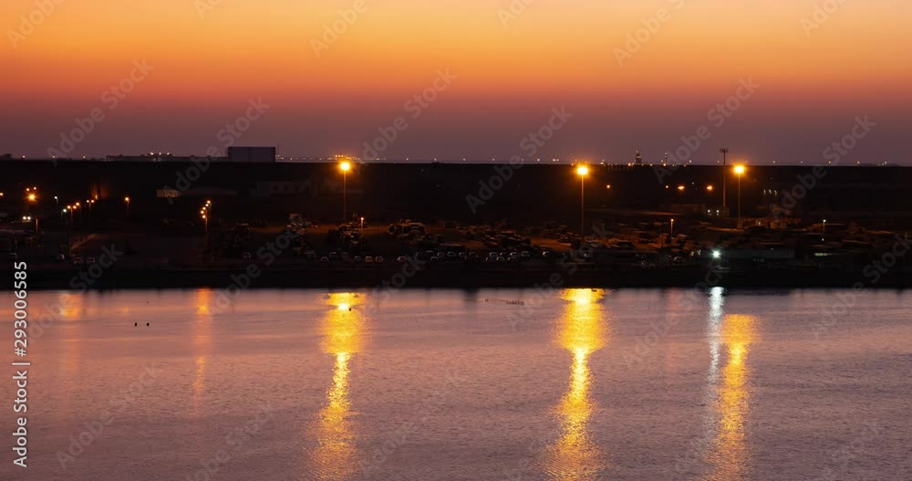 Timelapse of sunrise at the port in Bahrain (4K Timelapse) Timelapse of sunrise at the port in Bahrain (4K Timelapse)