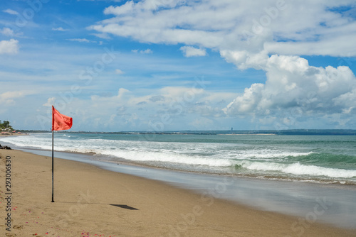 Petitenget Beach in Seminyak with red flag