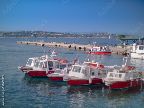 Multiple boat taxis at a pier in Greece