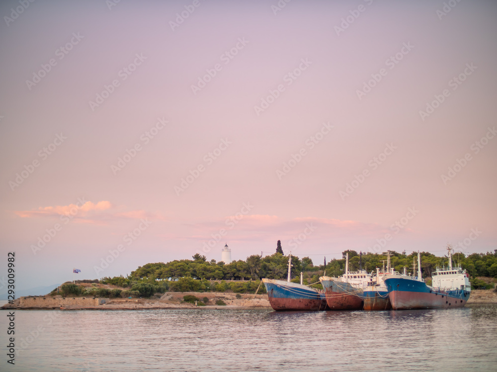 Big blue and red fishing boats moored together