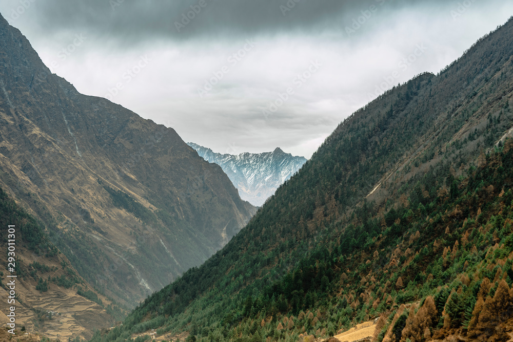 Fototapeta premium Beautiful Himalaya mountains covered with snow and wrapped in fog, Manaslu Circuit Trek.