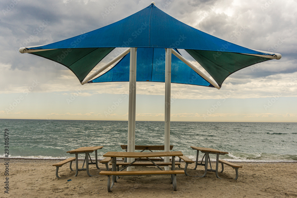 Public beach shelter and benches at Pickering waterfront, Ontario, Canada