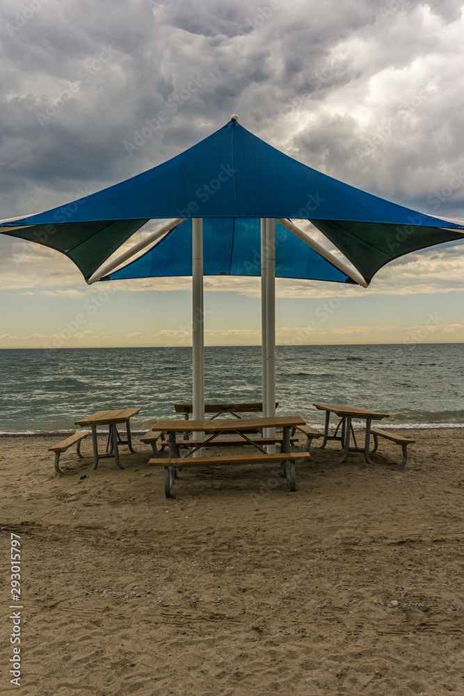 Fototapeta premium Public beach shelter and benches at Pickering waterfront, Ontario, Canada