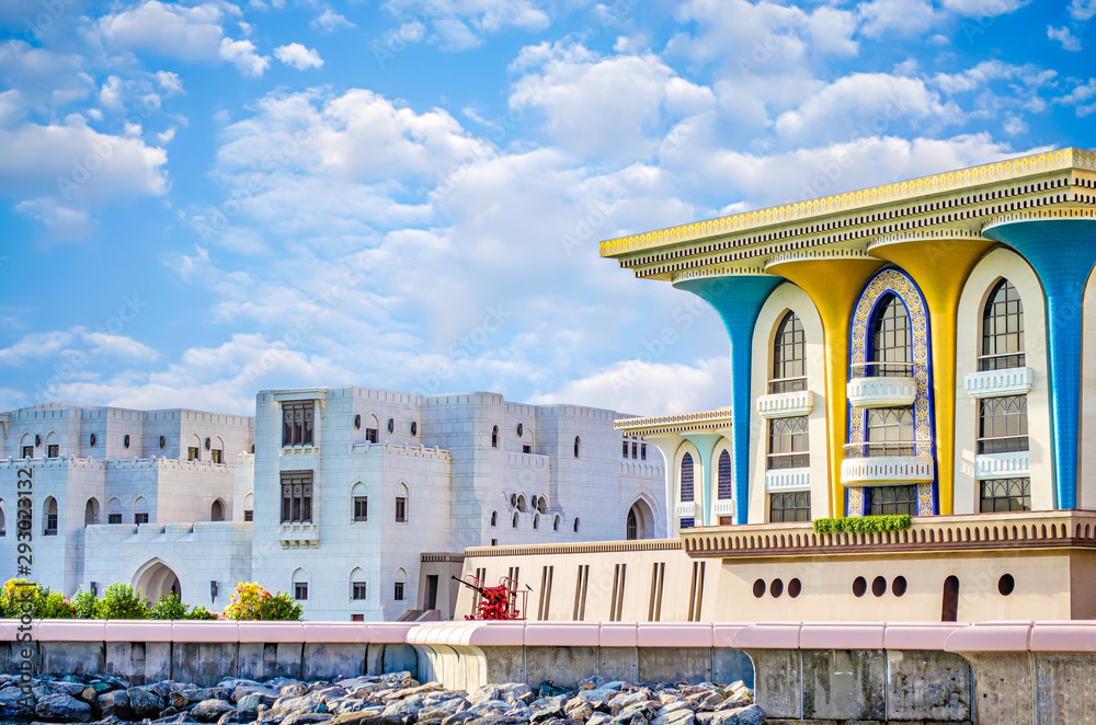 Fototapeta premium Colorful palace with marble buildings facing the sea. From Muscat, Oman.