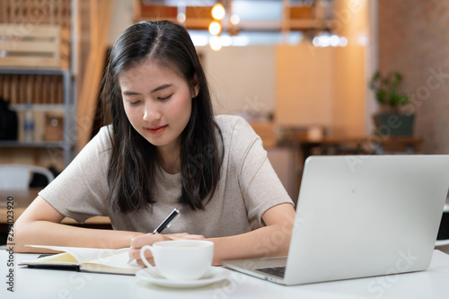 freelancer asian girl working at co-working space.