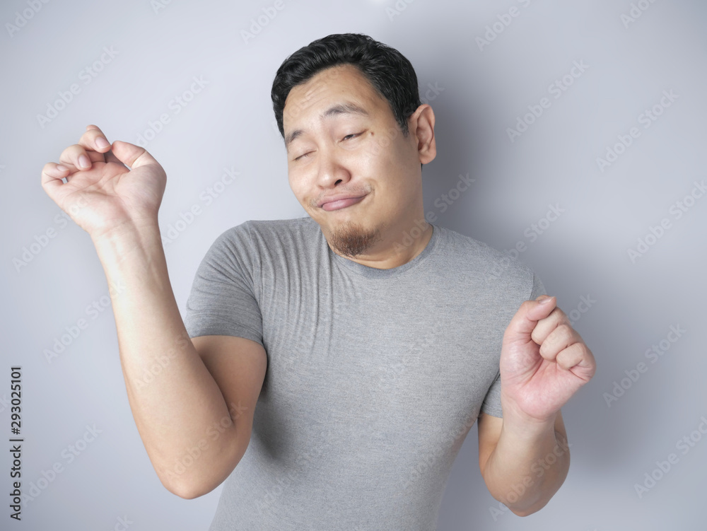Naklejka premium Happy Funny Asian Man Dancing Full of Joy