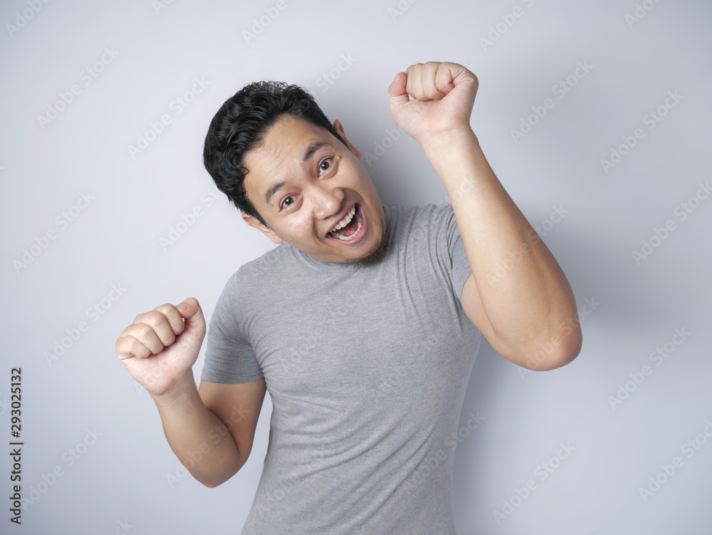 Fototapeta premium Happy Funny Asian Man Dancing Full of Joy