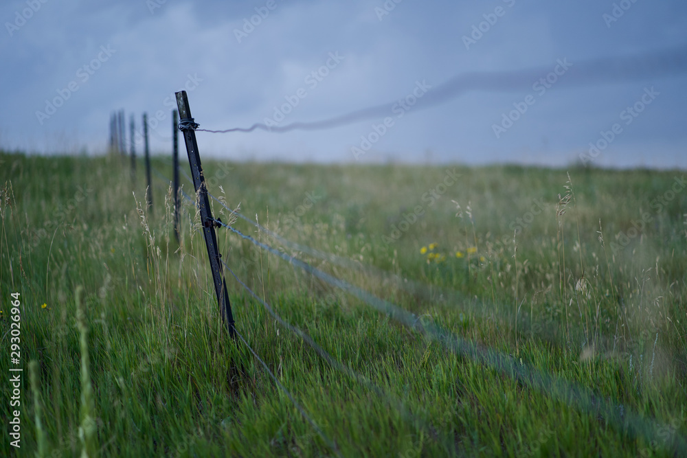 Fence in Stormy Farm Land Fence in Stormy Farm Land