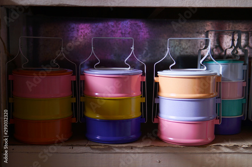 Colorful tiffin in the cabinet in the pedestrian market photo