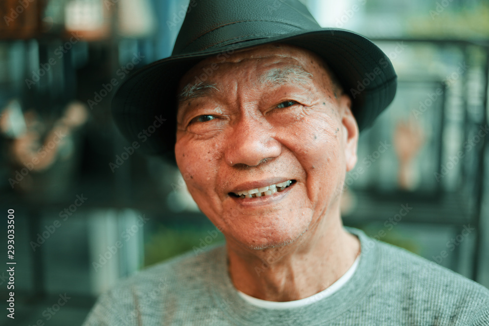 Asian senior man drinking coffee in coffee shop cafe Asian senior man drinking coffee in coffee shop cafe
