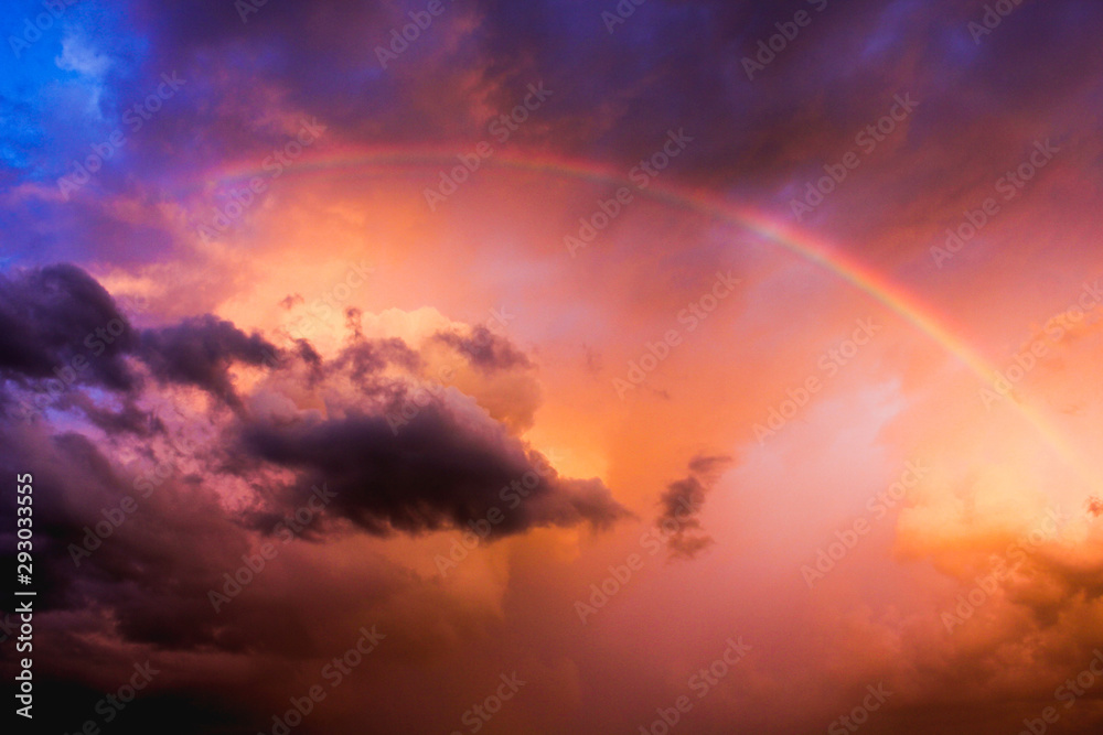 Rainbow in the clouds after a storm during sunset