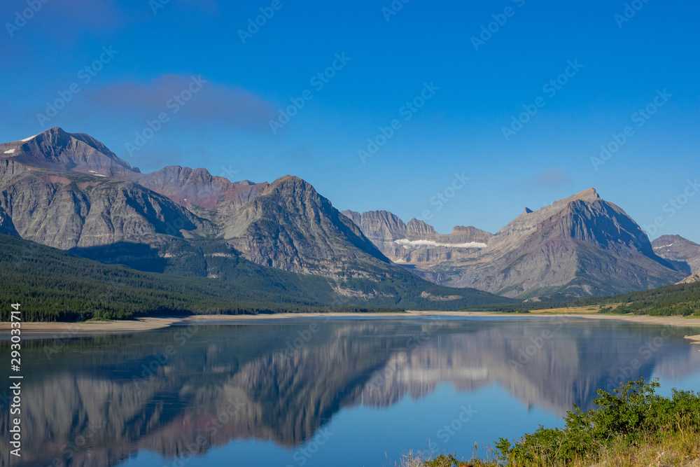 Morning view of the Wynn Mountain with reflection and Lake Sherburne