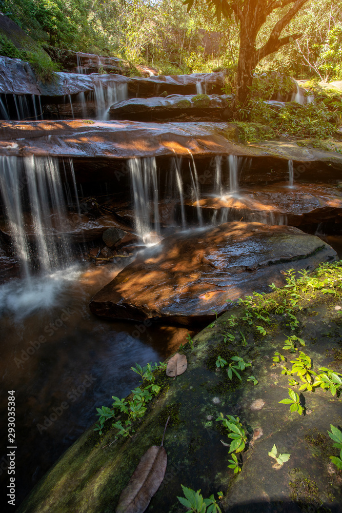 Fototapeta premium soft water of the stream in the WIMAN THIP Waterfall natural park, Beautiful waterfall in rain forest