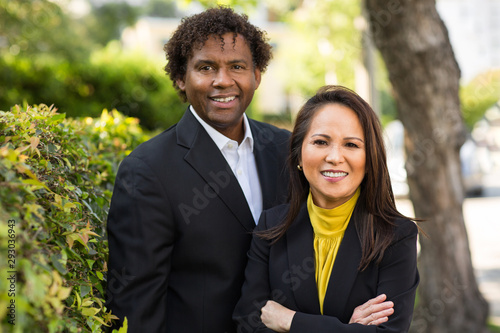 Portrait of an African American Businessman and Asian Businesswoman.