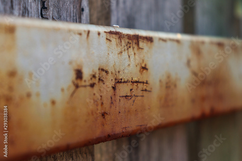 rust on the back of a wooden fence