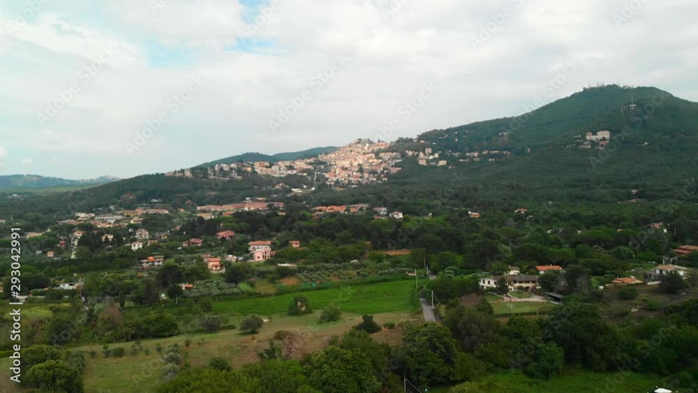 AERIAL DOLLY IN: Drone flying towards Rocca di Papa in the Roman province, Italy with a stunning view of the small remote village on top the hills AERIAL DOLLY IN: Drone flying towards Rocca di Papa in the Roman province, Italy with a stunning view of the small remote village on top the hills