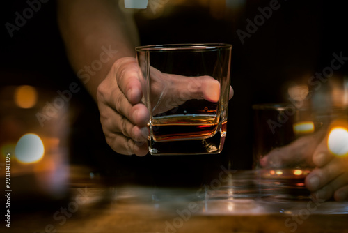 Bartender Serve Whiskey, on wood bar 