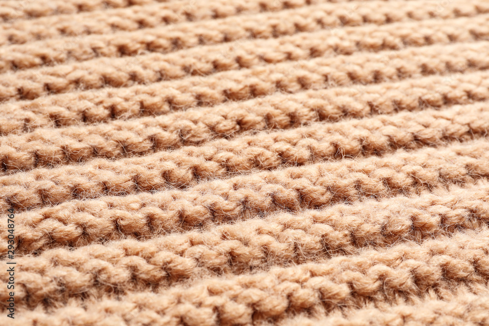 Beige winter sweater as background, closeup view Beige winter sweater as background, closeup view