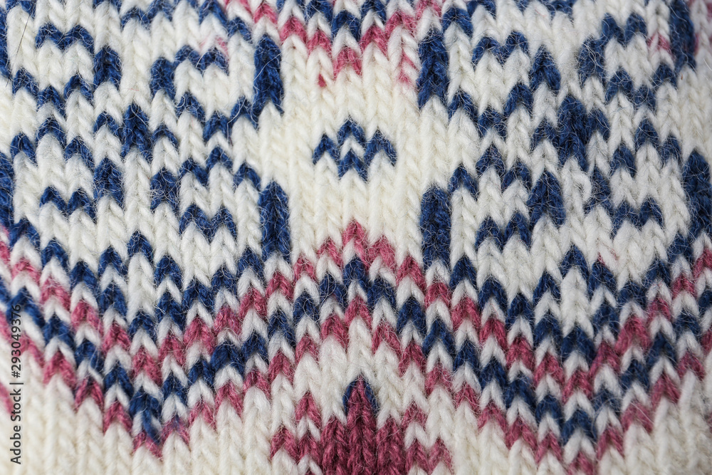 Knitted soft woolen sock as background, closeup