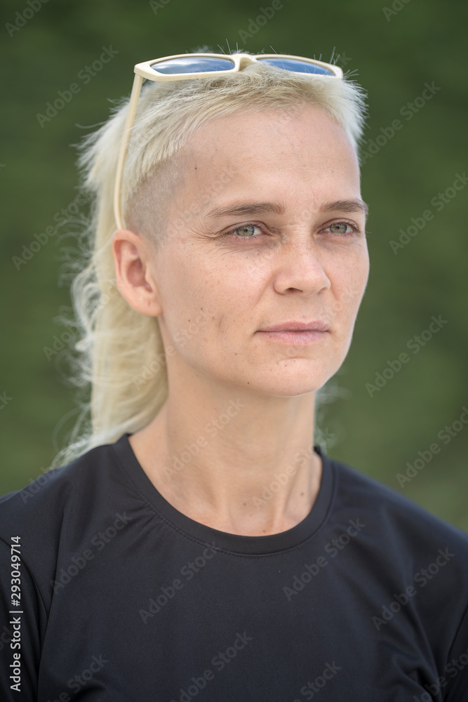 Portrait of a blonde girl on a background of nature. Portrait of a blonde girl on a background of nature.
