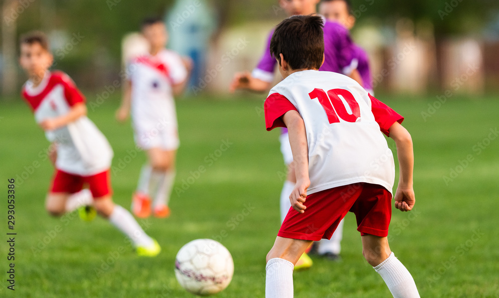 Young boys playing soccer.