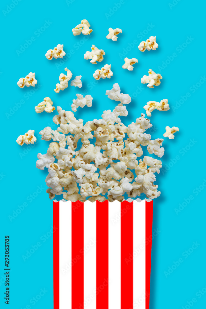 popcorn in a bowl on blue background