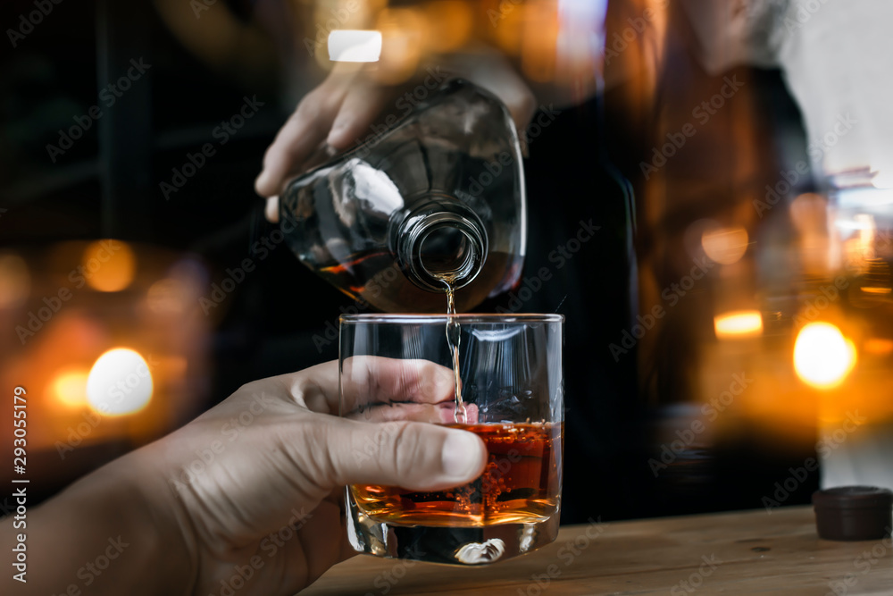 Bartender Serve Whiskey, on wood bar 