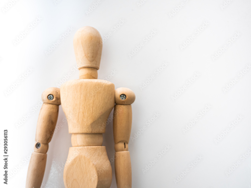 Manikin wooden puppet doll figure on white isolated background for artist drawing and adjust movement reference of human body on paper art Manikin wooden puppet doll figure on white isolated background for artist drawing and adjust movement reference of human body on paper art